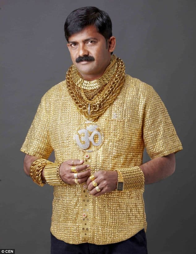 This may contain: a man in gold is standing with his hands on his hips and the caption says, is it gold in here? or is it just me?